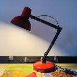 Old articulated desk lamp in red metal