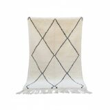 Moroccan Berber rug with black diamond patterns