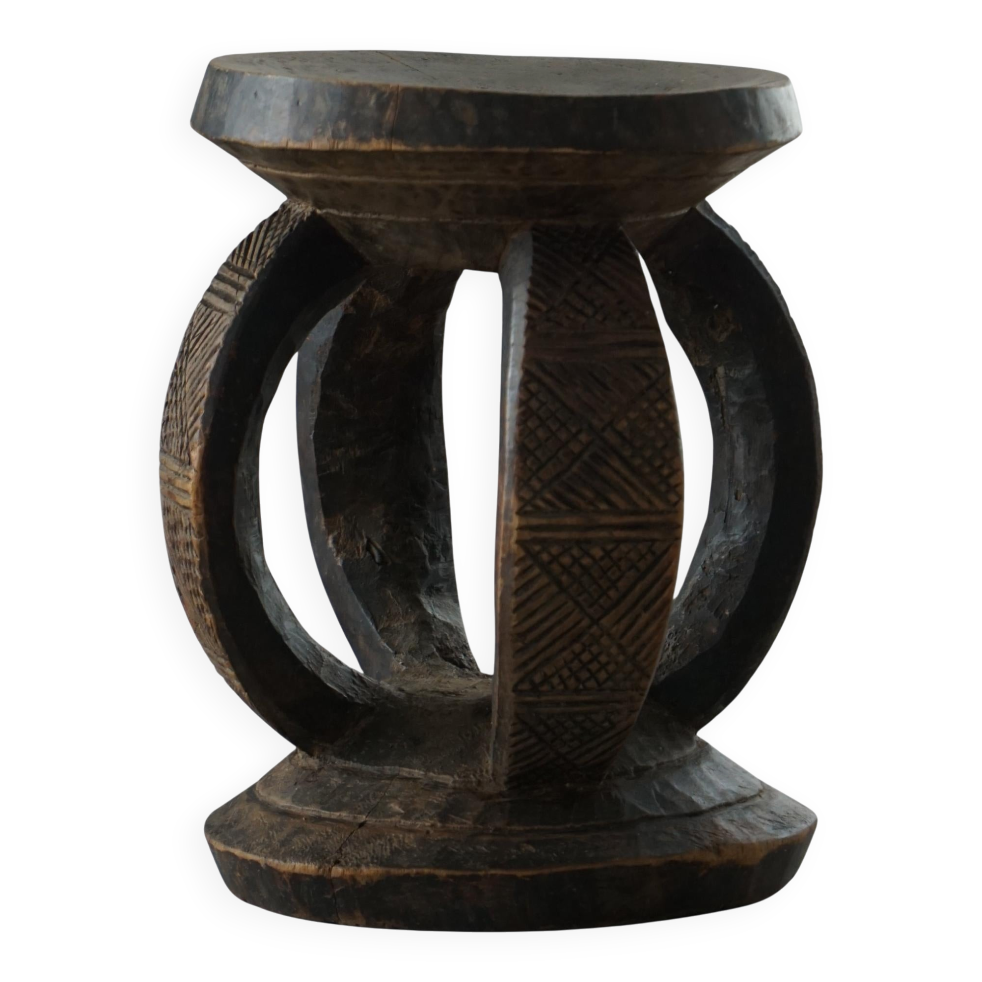 Antique wooden stool hand-carved by the Dogon people of Africa, Wabi-Sabi style, mid-20th century.