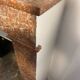 Marble fireplace surround with closed hearth frame.