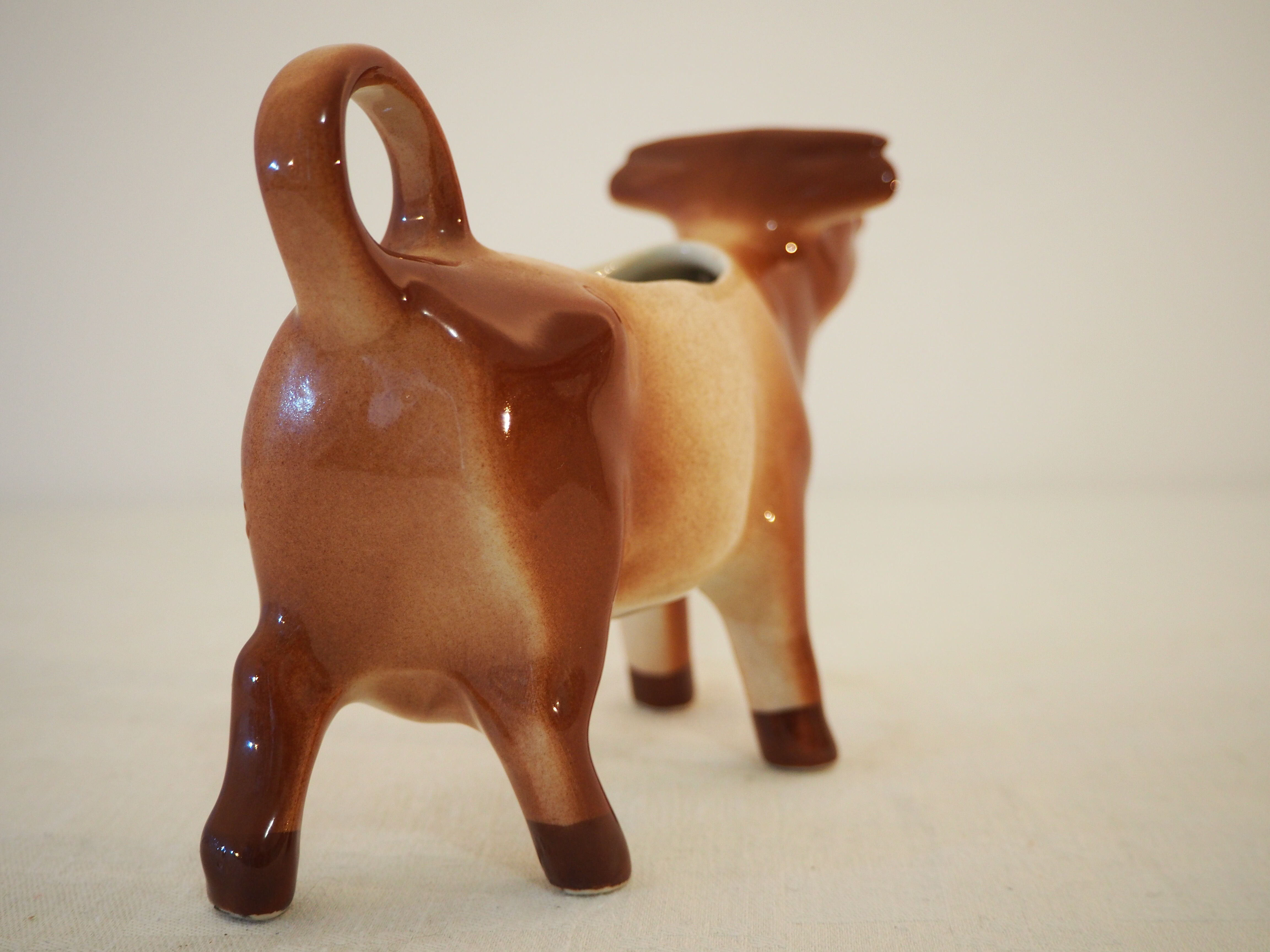 Milk jar in the shape of a vintage ceramic cow