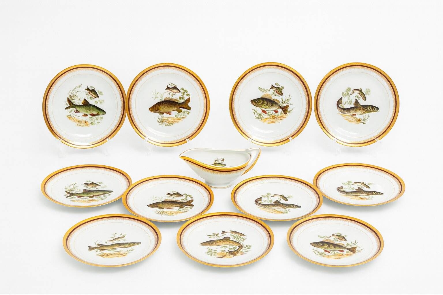 Porcelain plates and fish decoration sauce boat from Limoges, 1980s, set of 13.