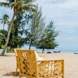 Pair of rattan armchairs with fan patterns