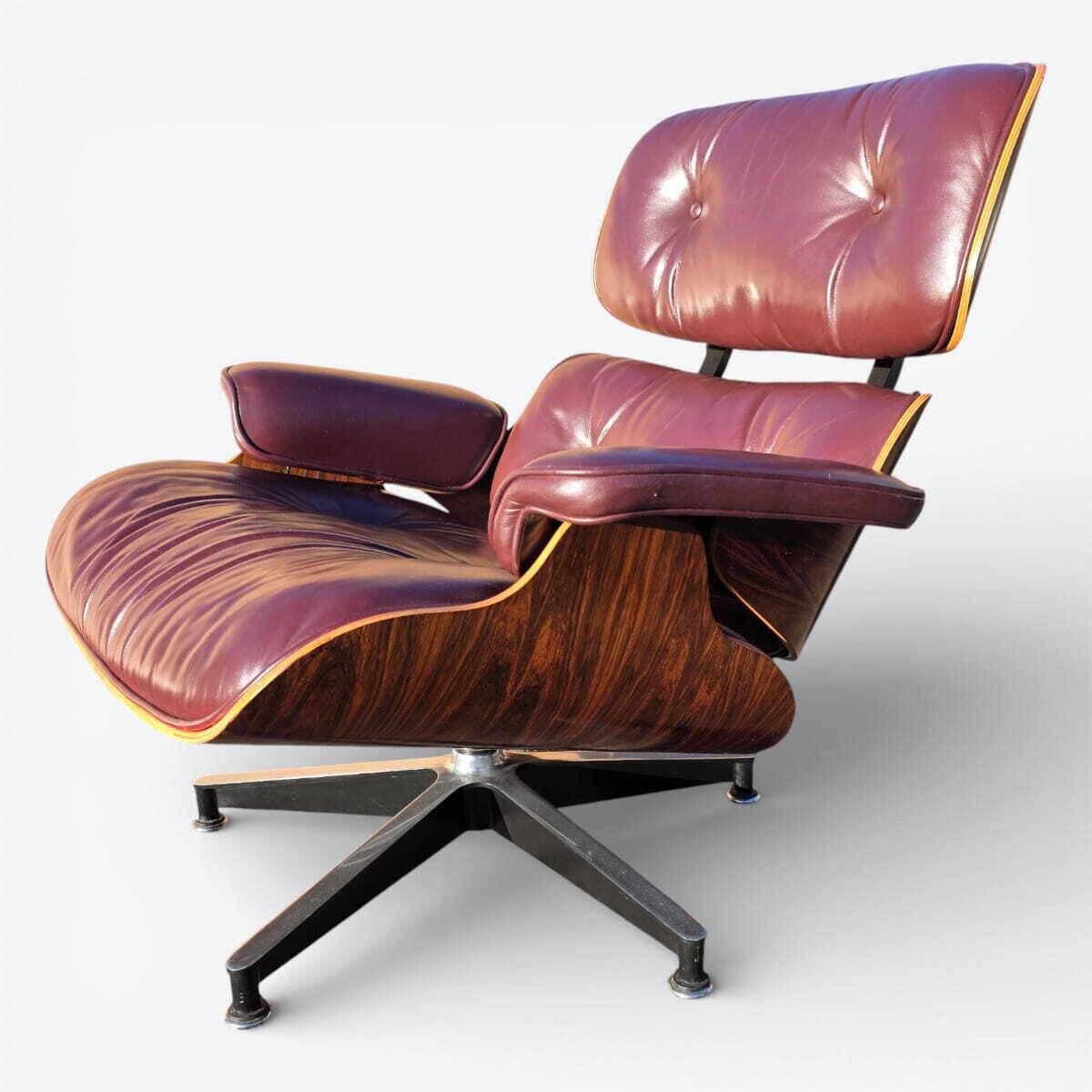 Original Eames lounge chair by Herman Miller in burgundy rosewood.