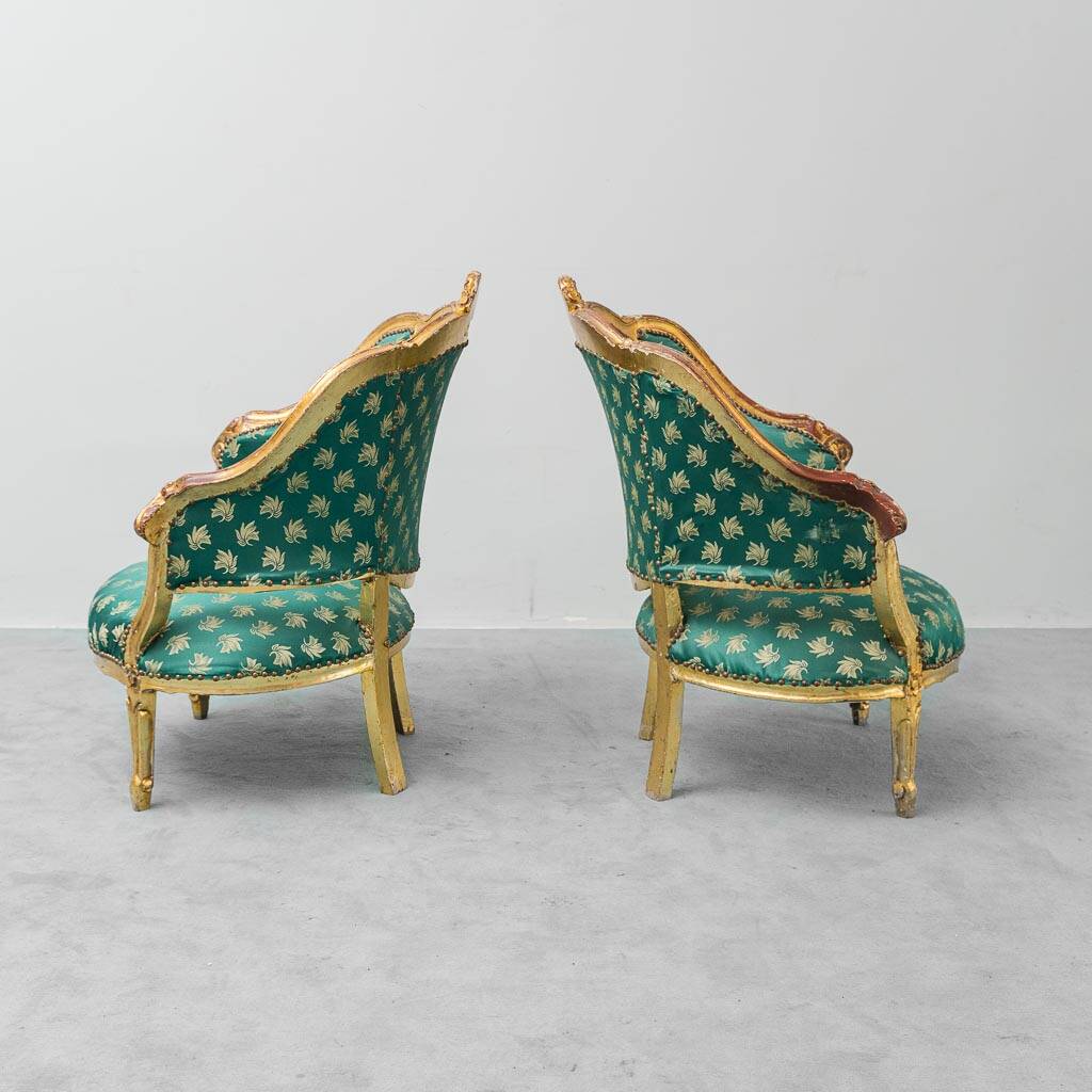 Pair of Louis XV style gilded armchairs with vintage green fabric