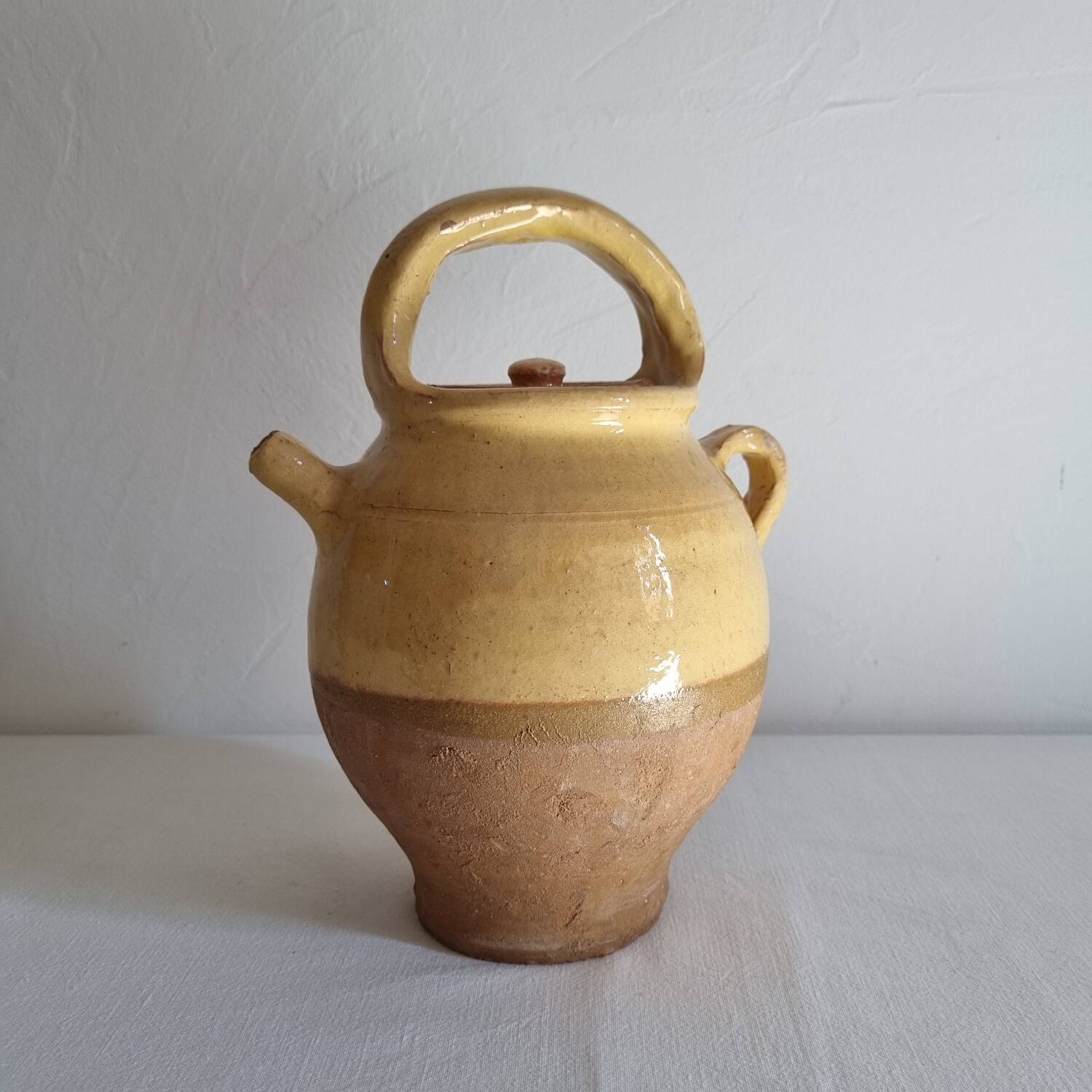 Glazed terracotta jug with lid