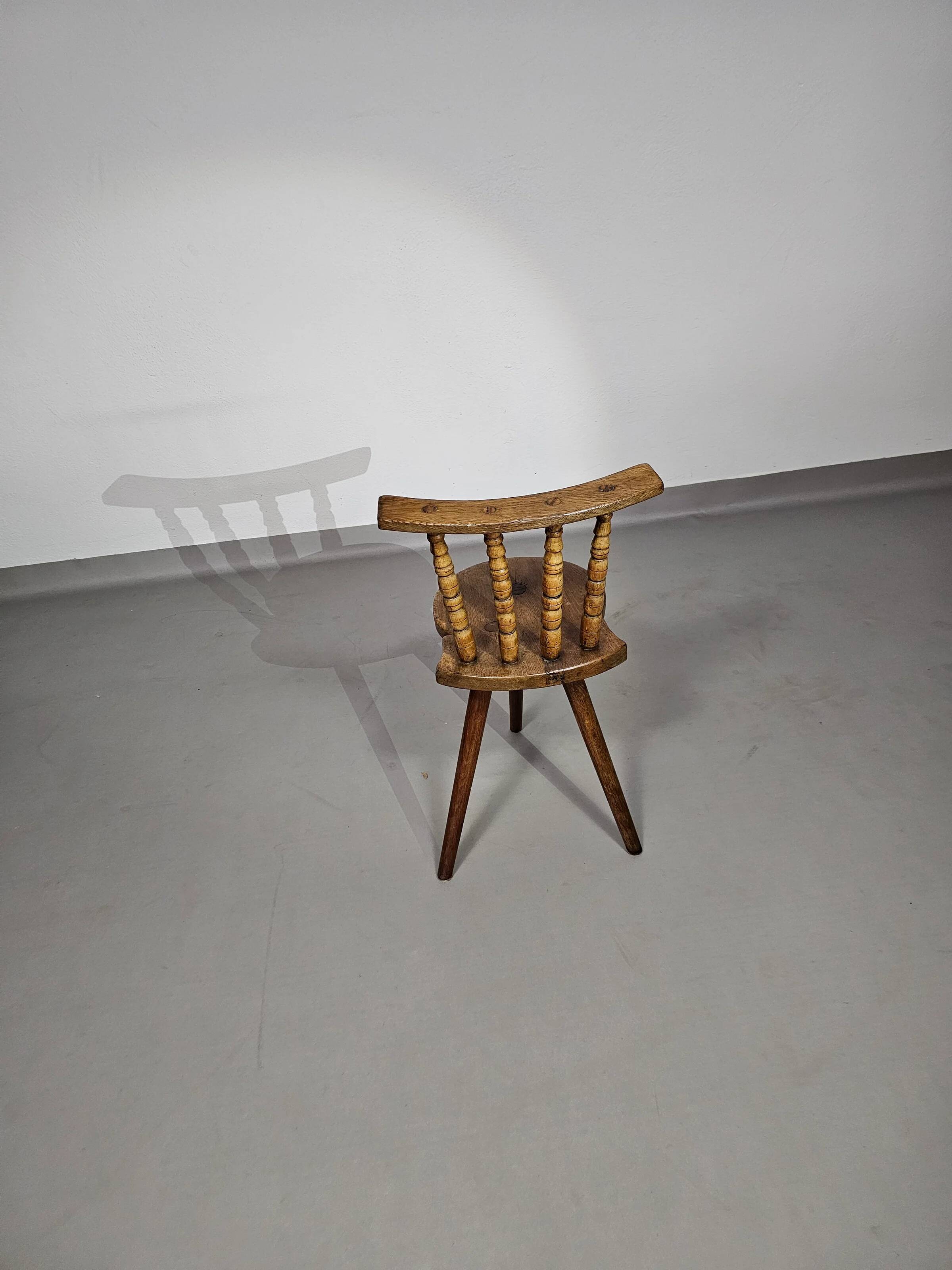 Old farmers tripod chair for decorative use