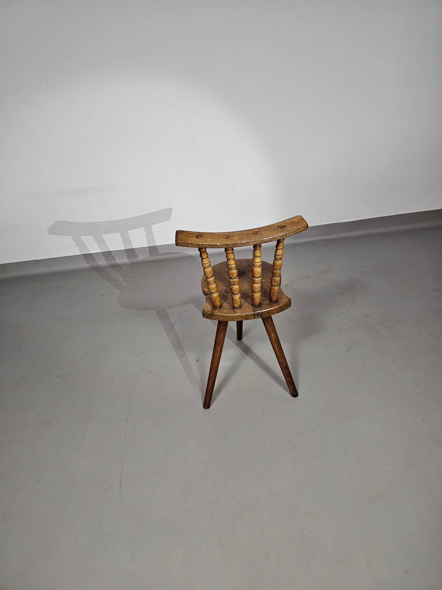 Old farmers tripod chair for decorative use