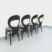 Set of 4 vintage Mouette chairs by Baumann in black wood from the 1960s.
