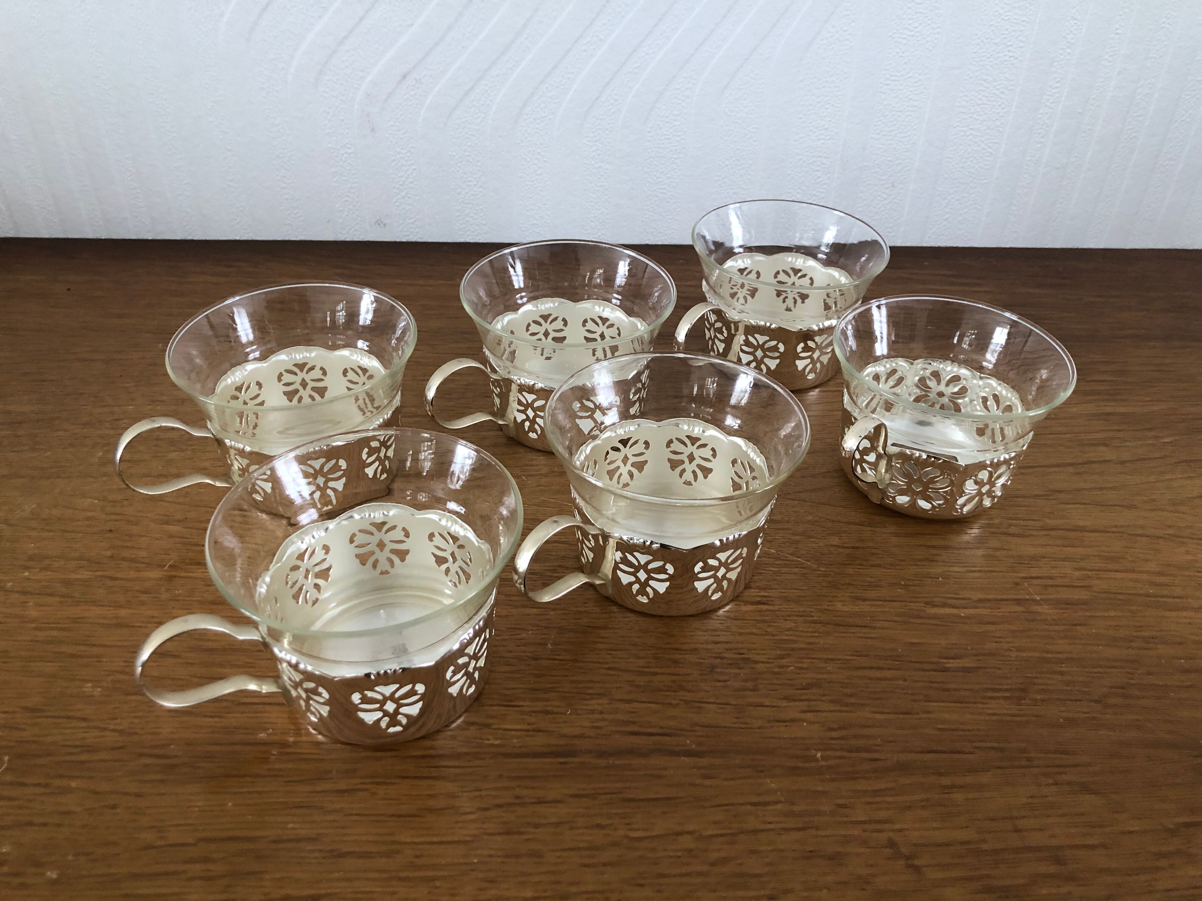 6 tea cups with silver metal support