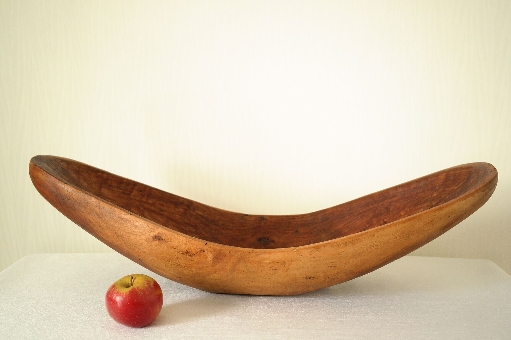 Brutalistic cut in exotic wood boomerang shape