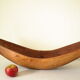 Brutalistic cut in exotic wood boomerang shape