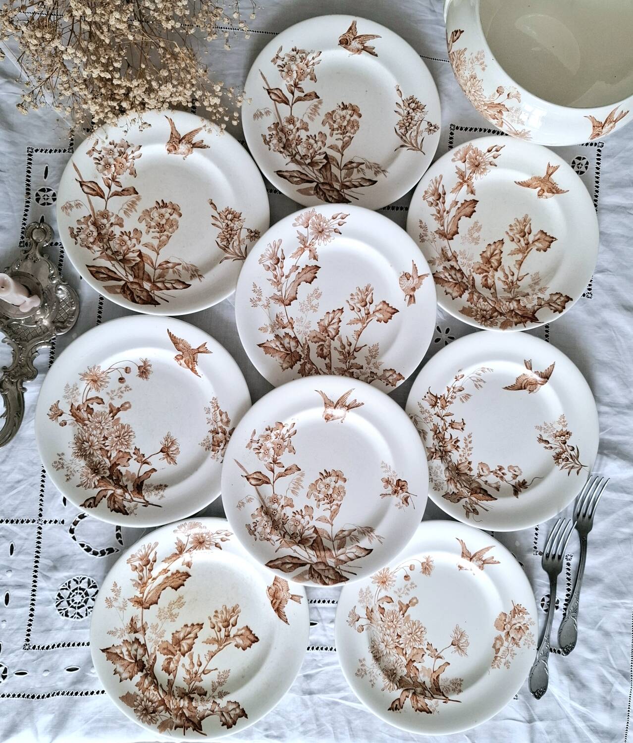 Antique iron earthenware plates accompanied by dishes