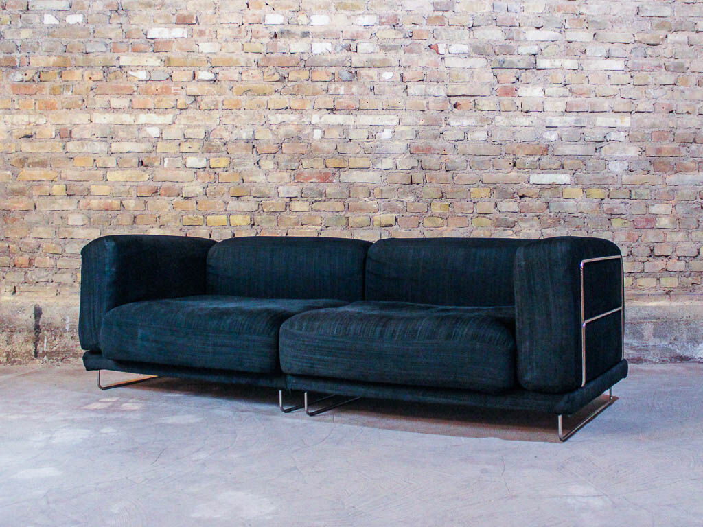 Black fabric design sofa with chromed steel frame