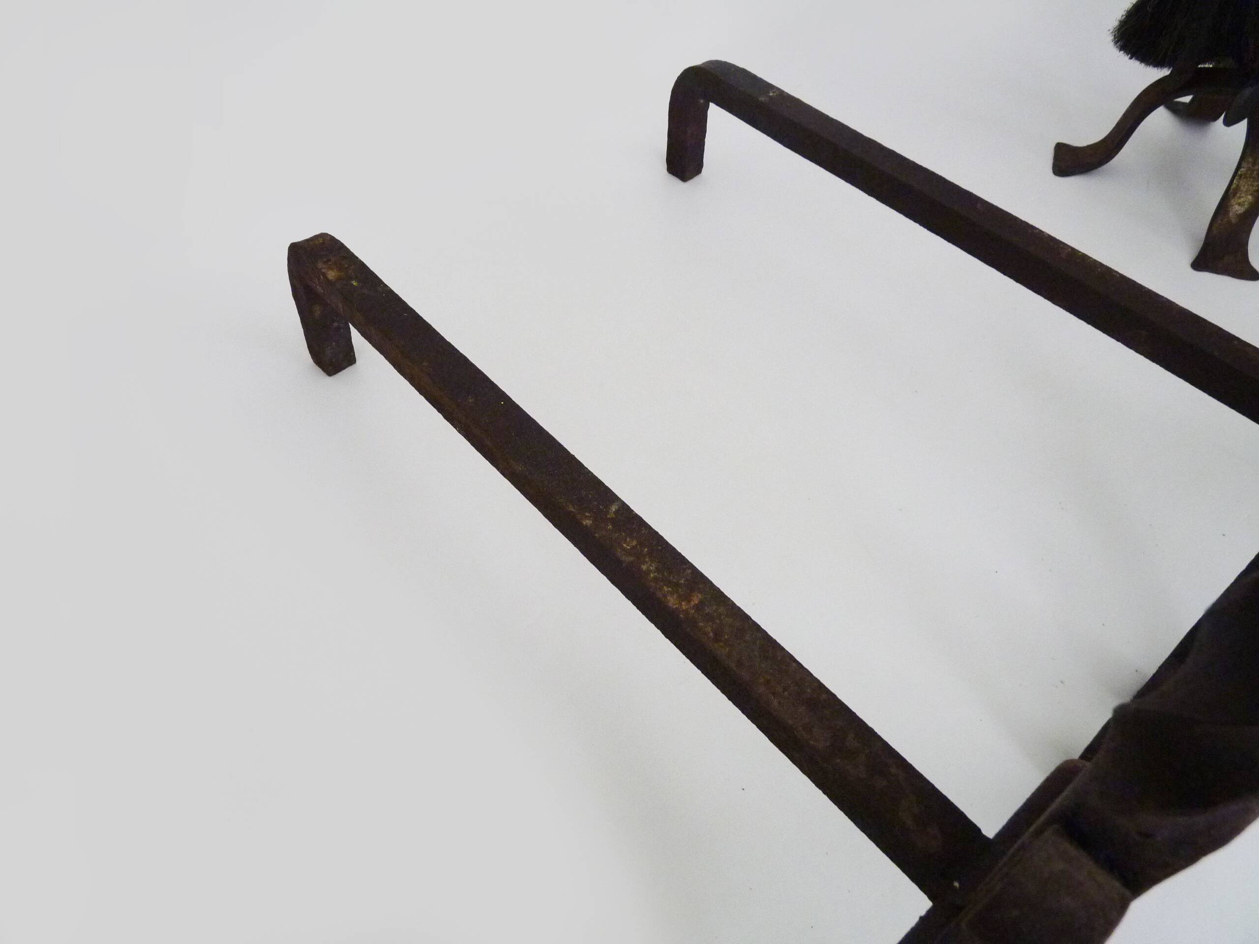 Pair of wrought iron andirons with 19th century fireplace set