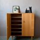 Vintage 1960s shoe cabinet in light wood and chrome metal.