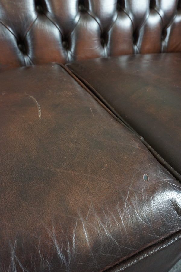 Chesterfield sofa in cowhide, 4 seats