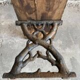 Dark brown wood and black cast-iron antique garden bench with weathered solid-wood seat