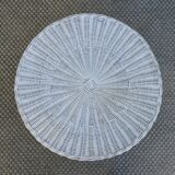 Round white rattan side table with storage underneath, circa 1970.