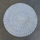 Round white rattan side table with storage underneath, circa 1970.