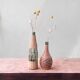 Two vintage bottles with wicker