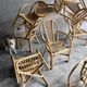 Set of 8 Manou rattan chairs with cane backrest.