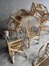 Set of 8 Manou rattan chairs with cane backrest.