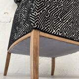 Club armchair in wood and fabric.