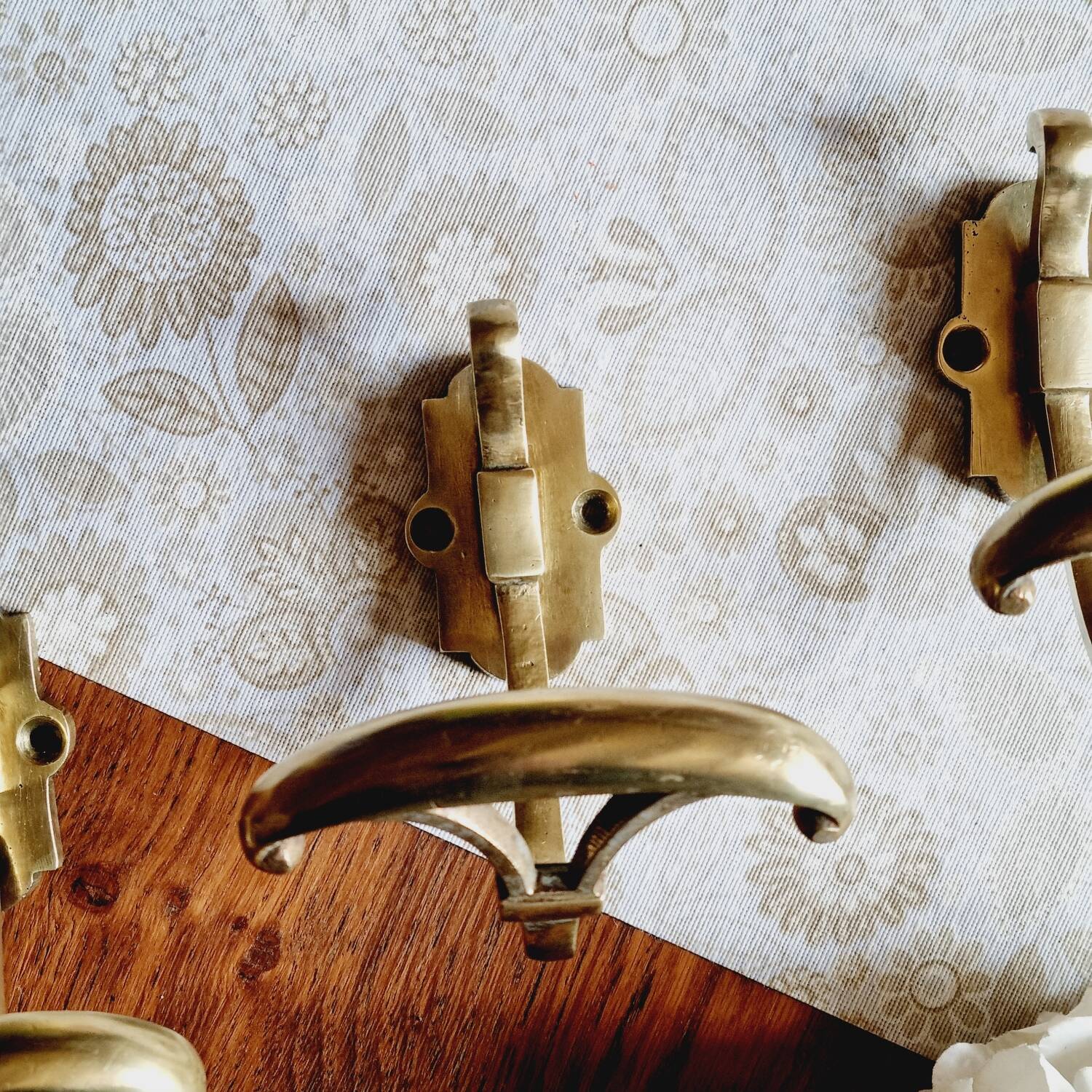 Trio of brass coat hooks or coat racks
