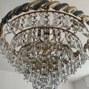 Crystal and brass chandelier with a cascade of pendants.