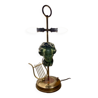Lampe ancienne avec harpe et visage sculpté