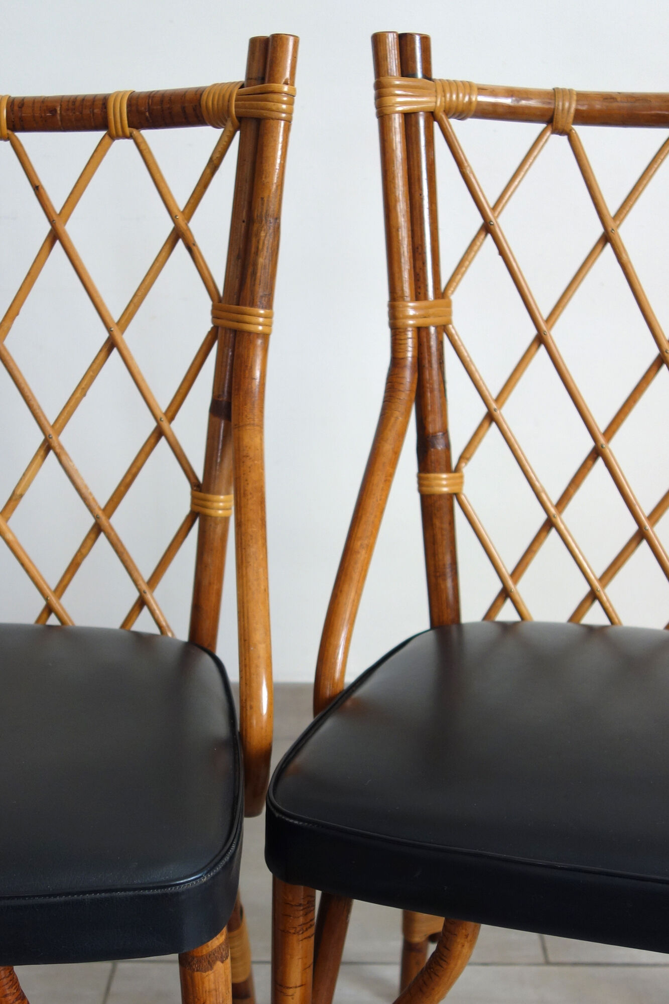 Pair of rattan and black skai bamboo chairs, 60s