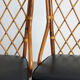 Pair of rattan and black skai bamboo chairs, 60s
