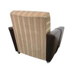 Vintage brown faux leather armchair / retro club chair on wheels