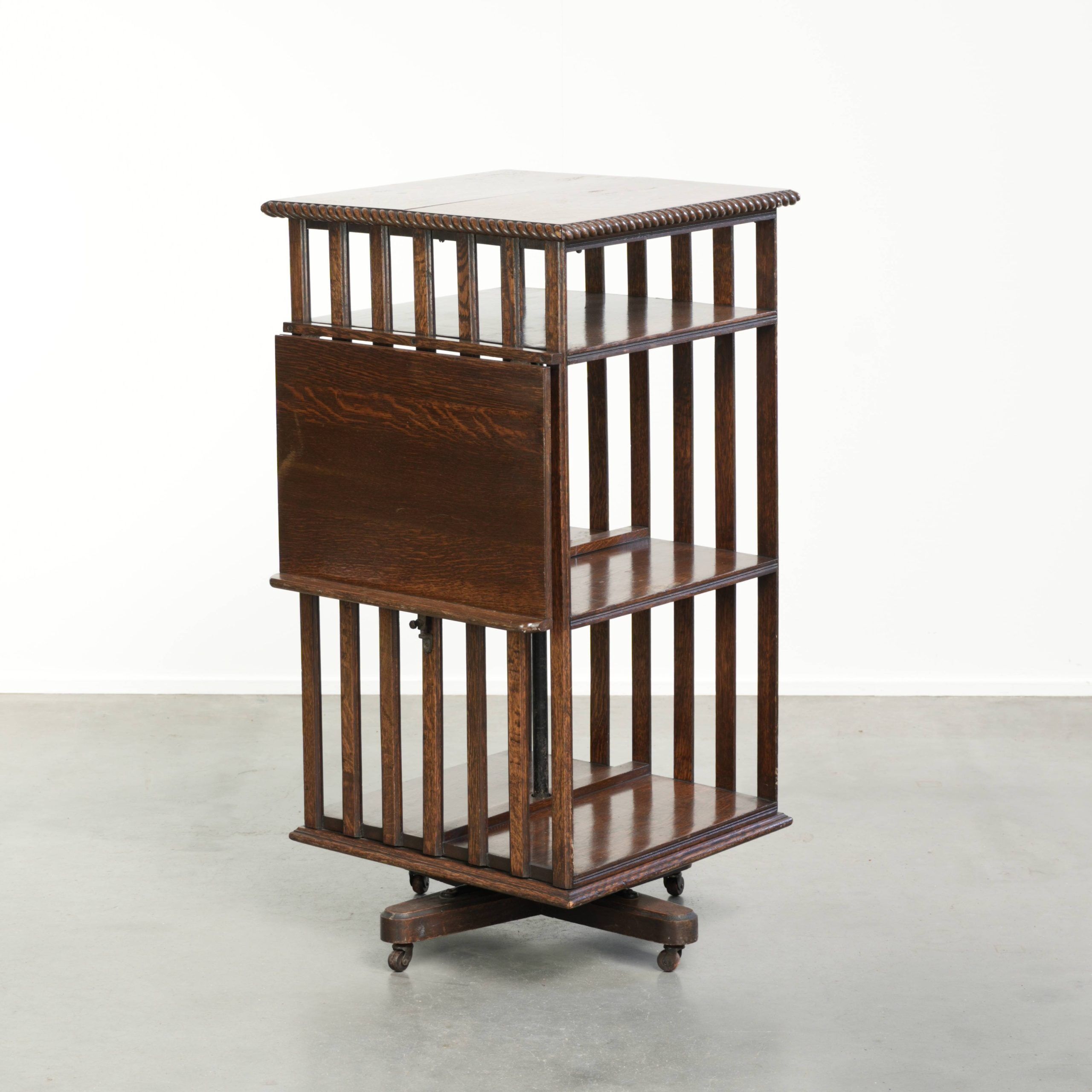Large antique English oak book carousel from the 19th century