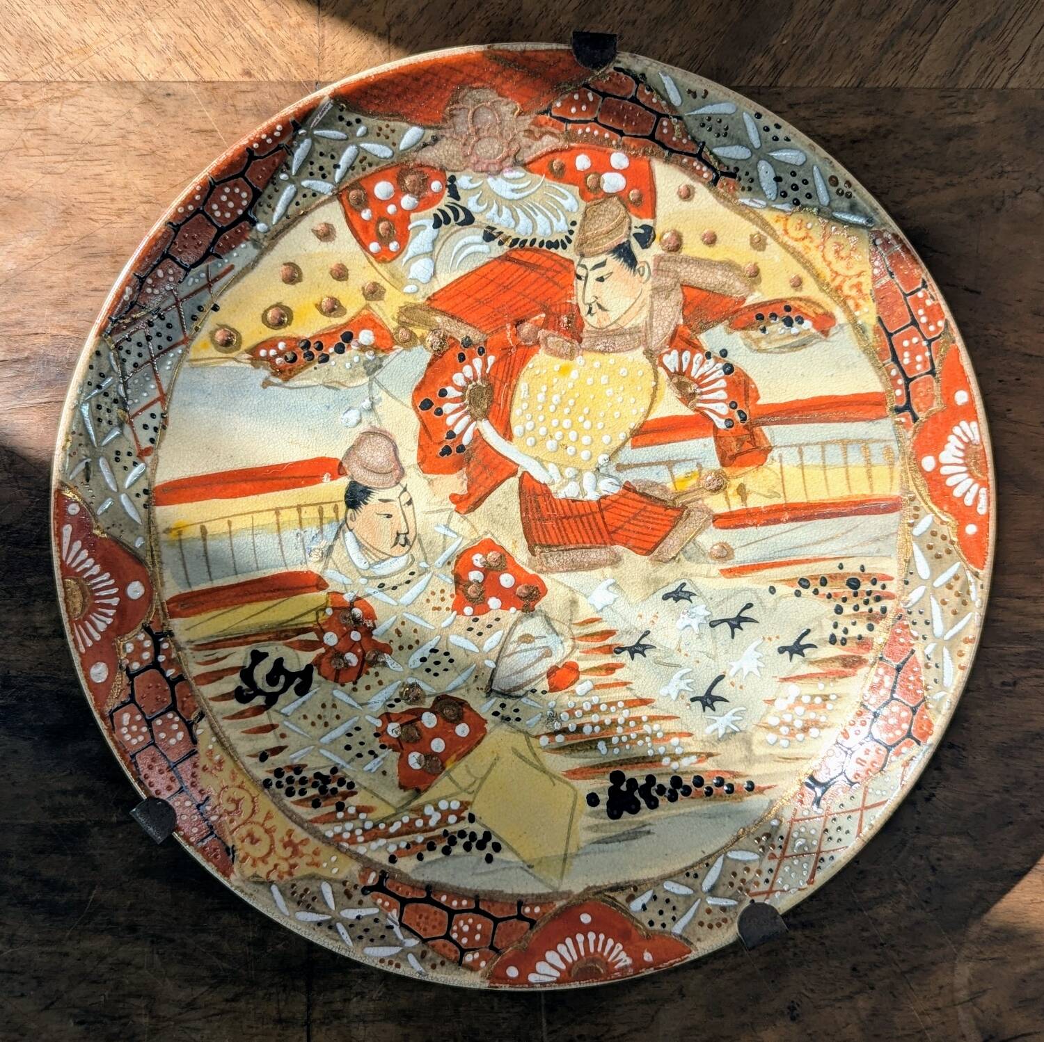 Antique Japanese Satsuma plate with red and gold decoration and figures