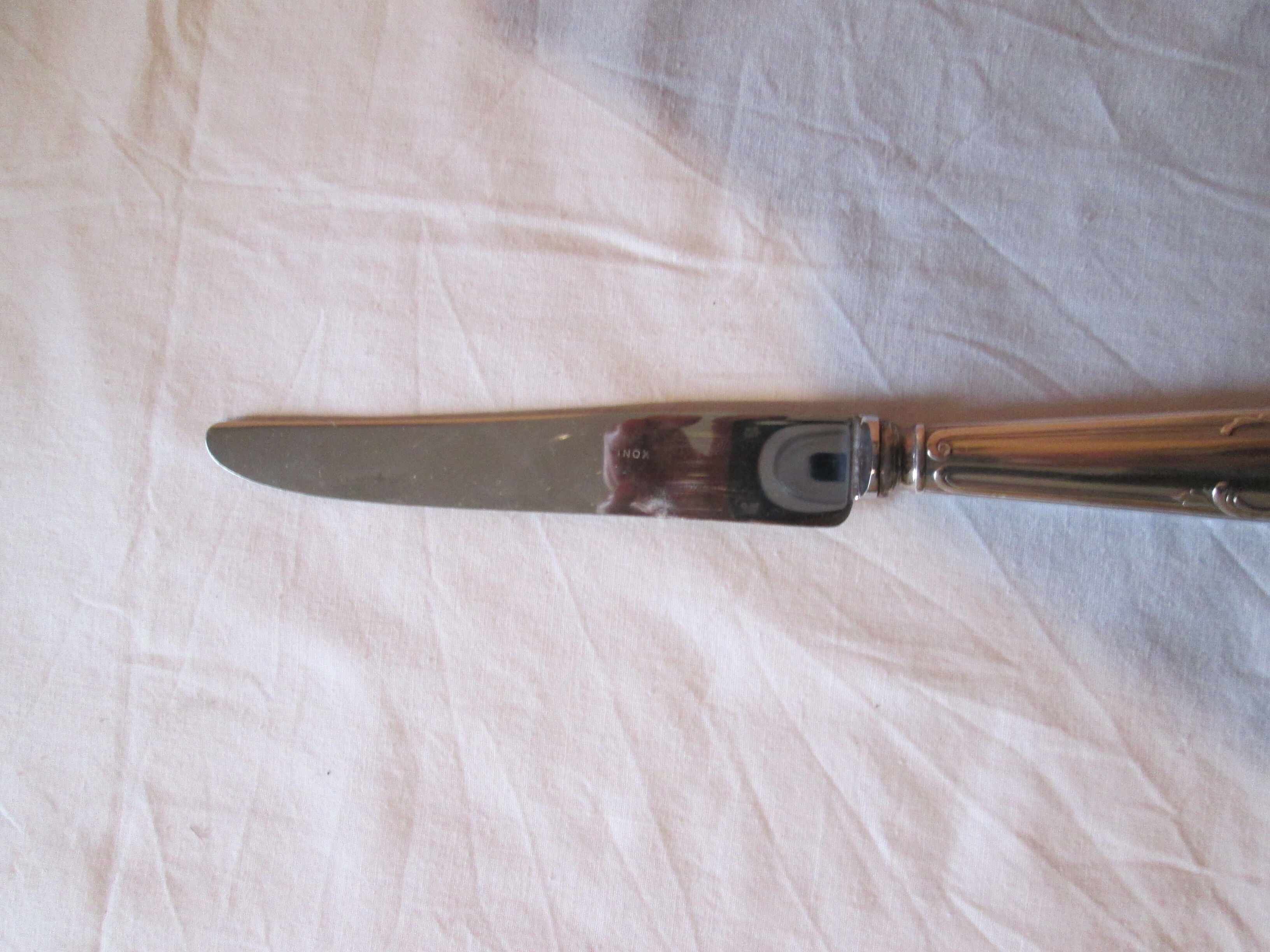 12 silver metal knives