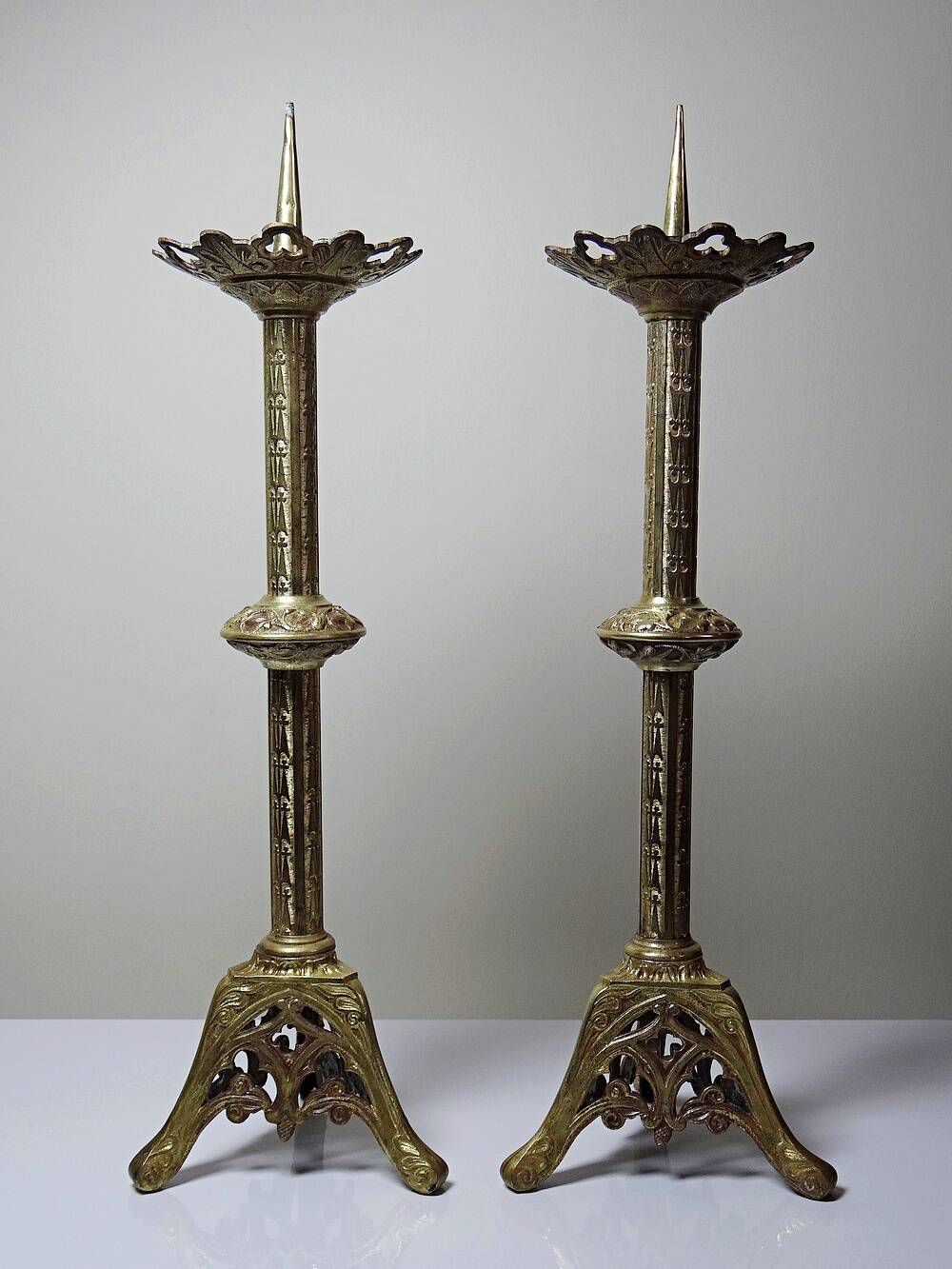 Large pair of antique gilded bronze candlesticks, Gothic style from the 19th century.