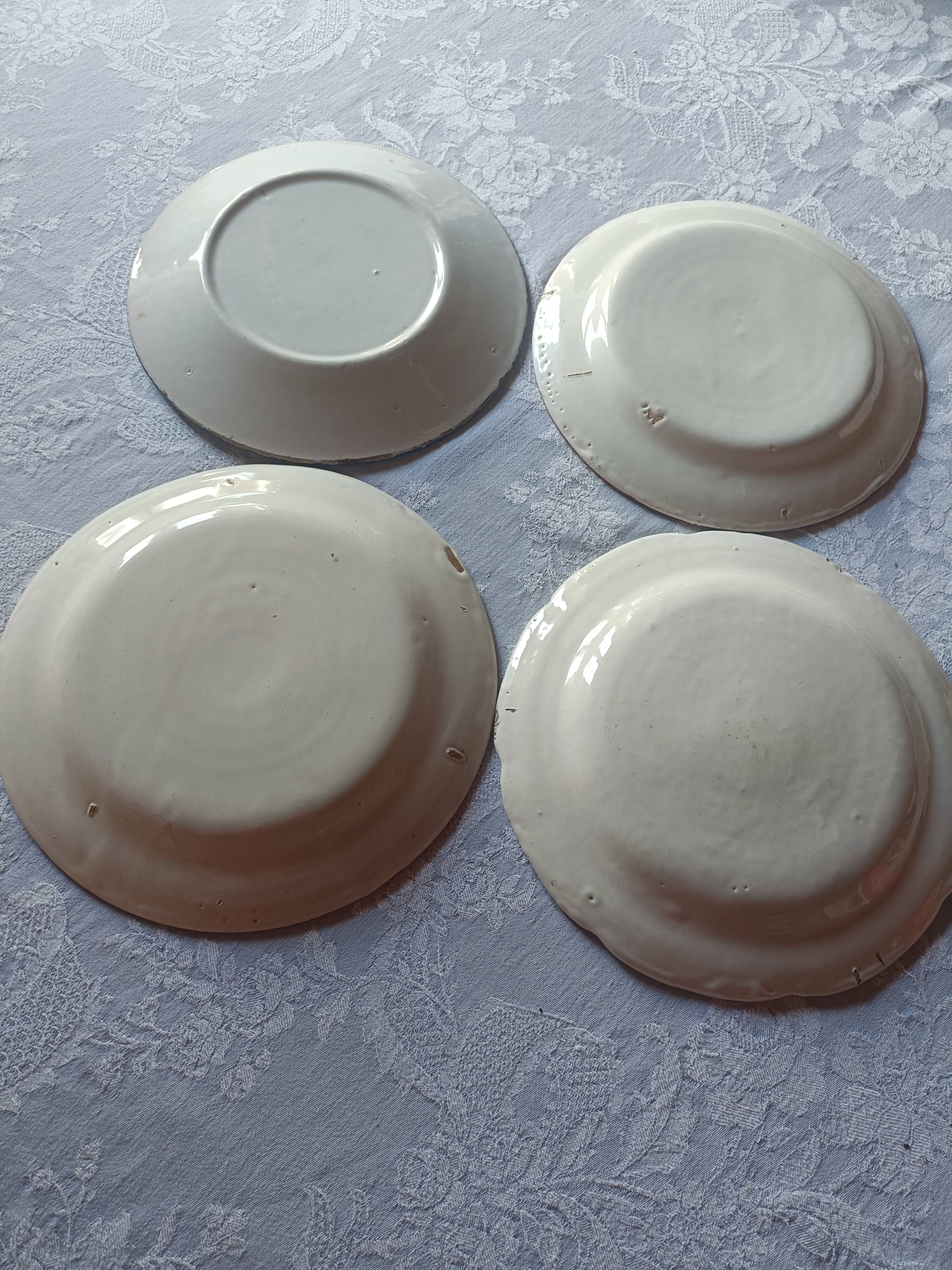 Set of 4 19th-century earthenware plates.