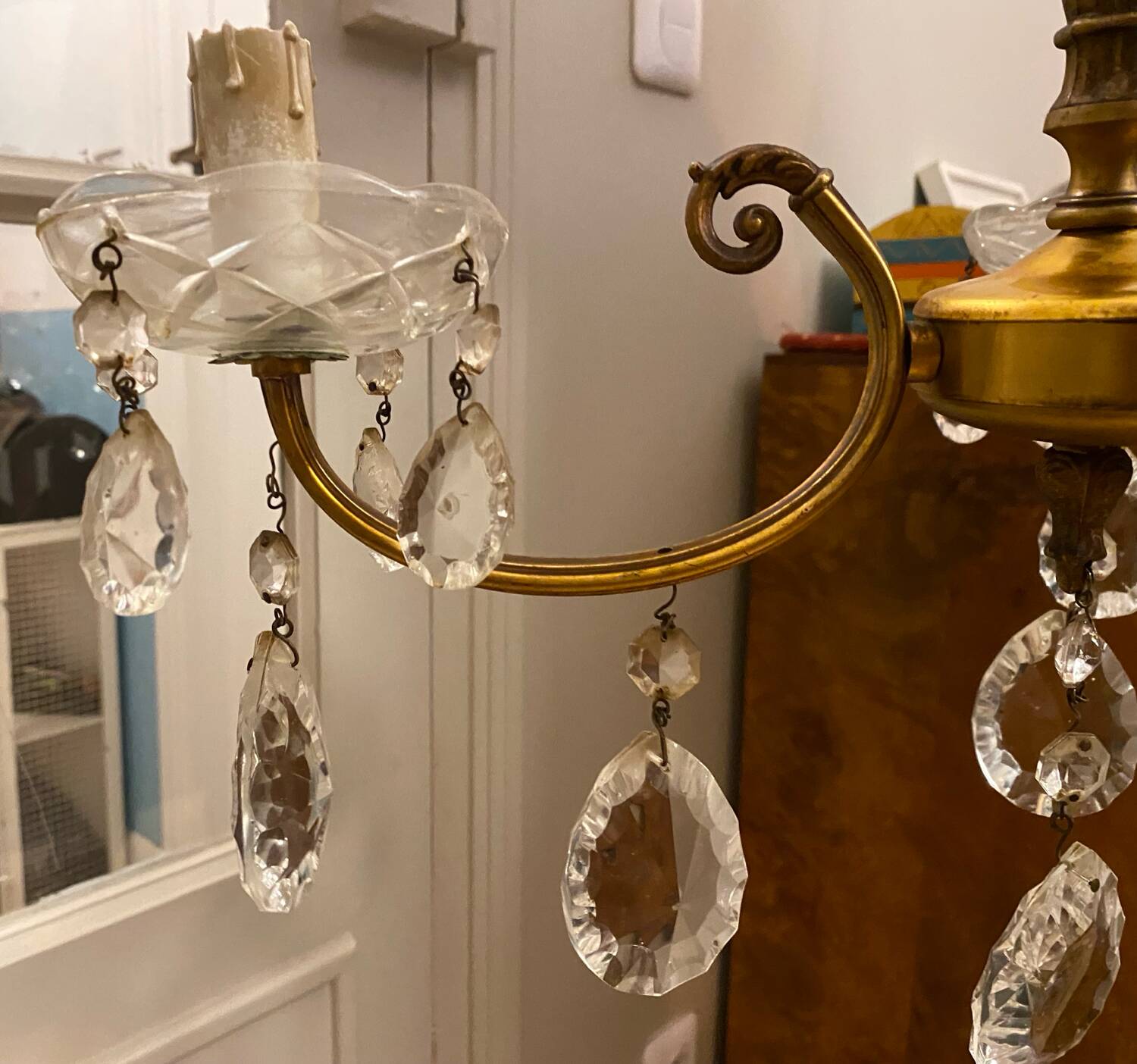 Golden brass chandelier and glass