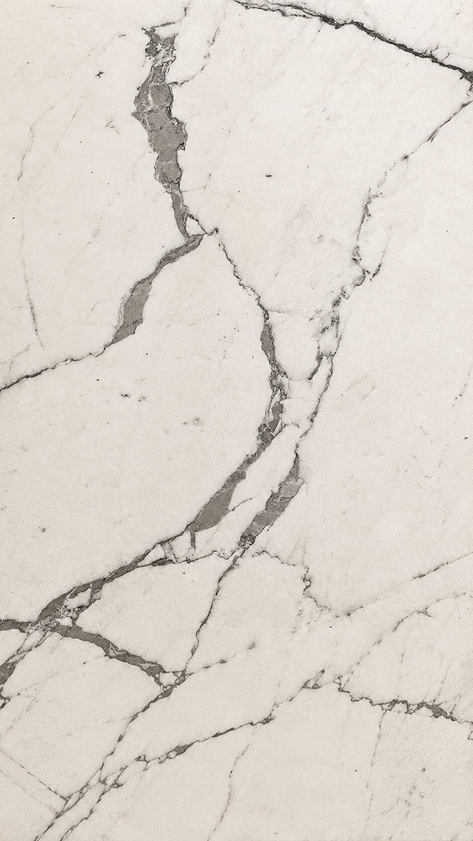 Table with a solid Carrara marble base.