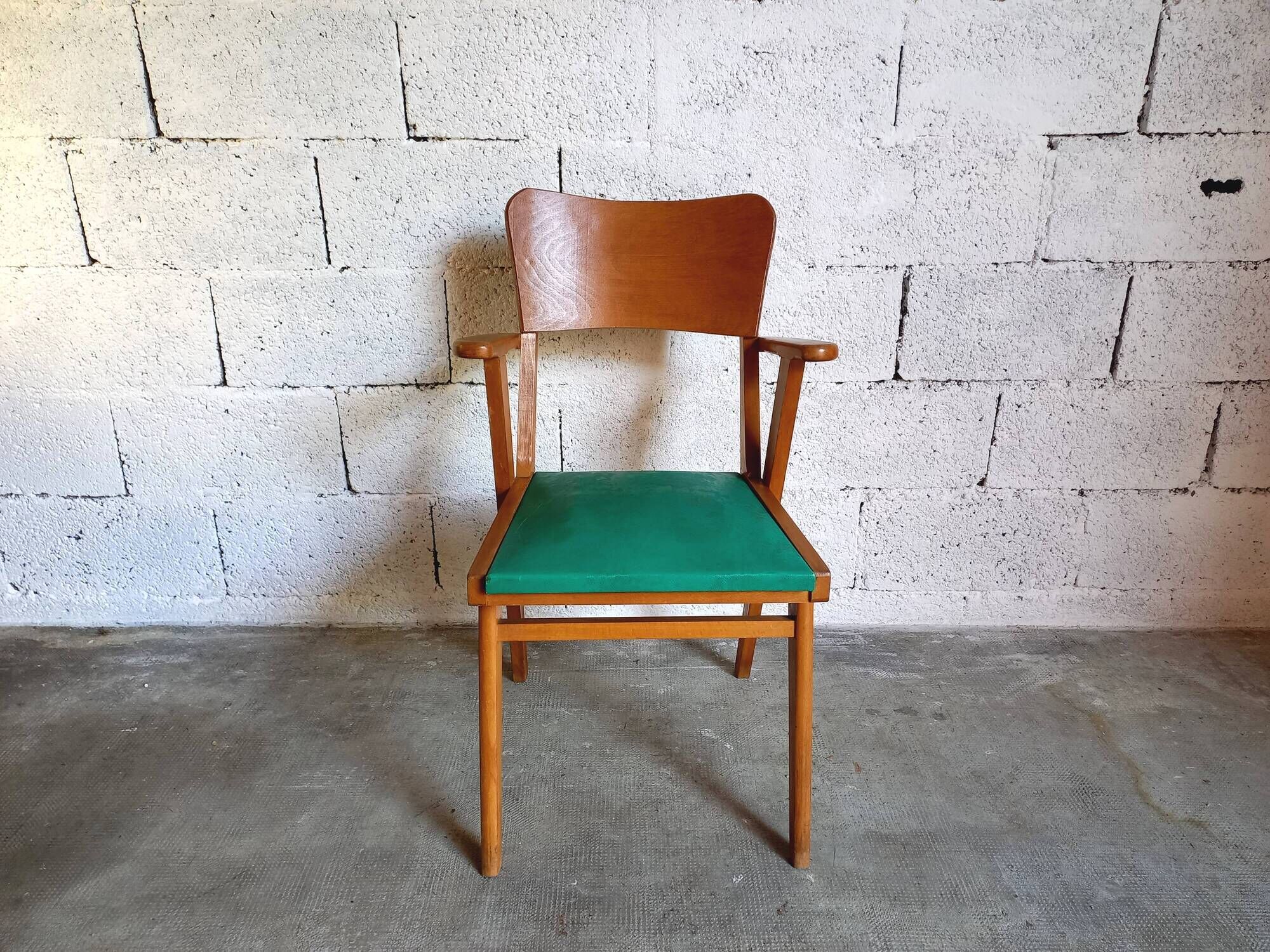 Vintage armchair in skai and wood 60s