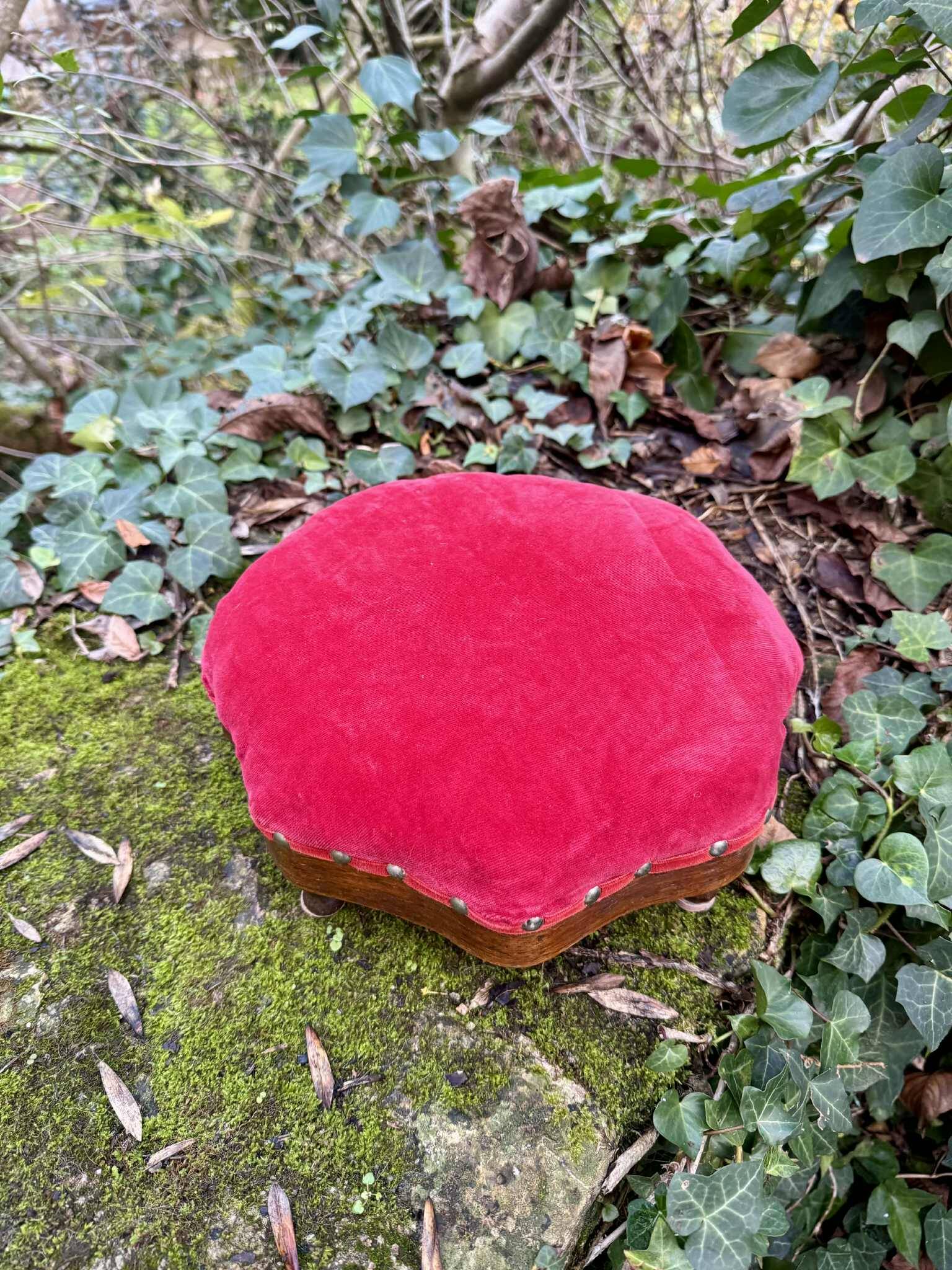 Red velvet footstool in the Louis XV style