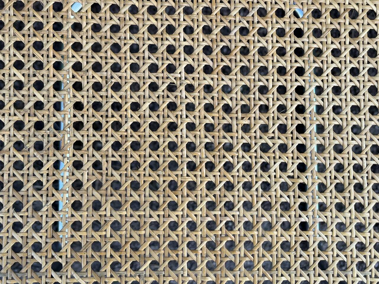 Wooden chair with caning in the style of Marcel Breuer.