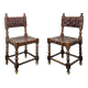 Pair of Spanish style chairs with leather straps.