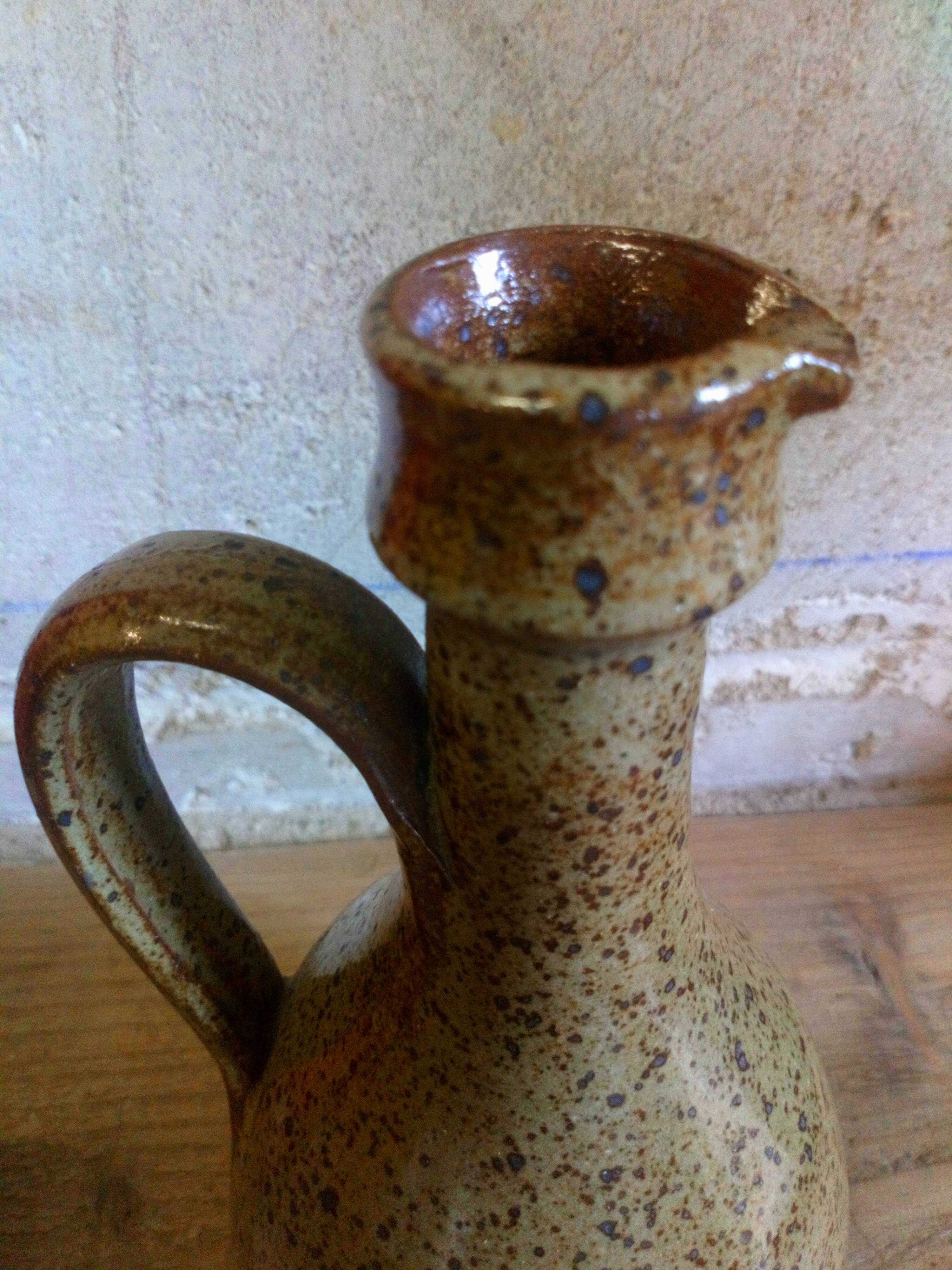 Vintage pottery in sandstone with handles and small beak