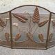 Foldable wrought iron fireplace screen sculpted from the 1950s.