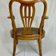 Fauteuil bas anglais en bois ajouré à assise cannée, 19e siècle