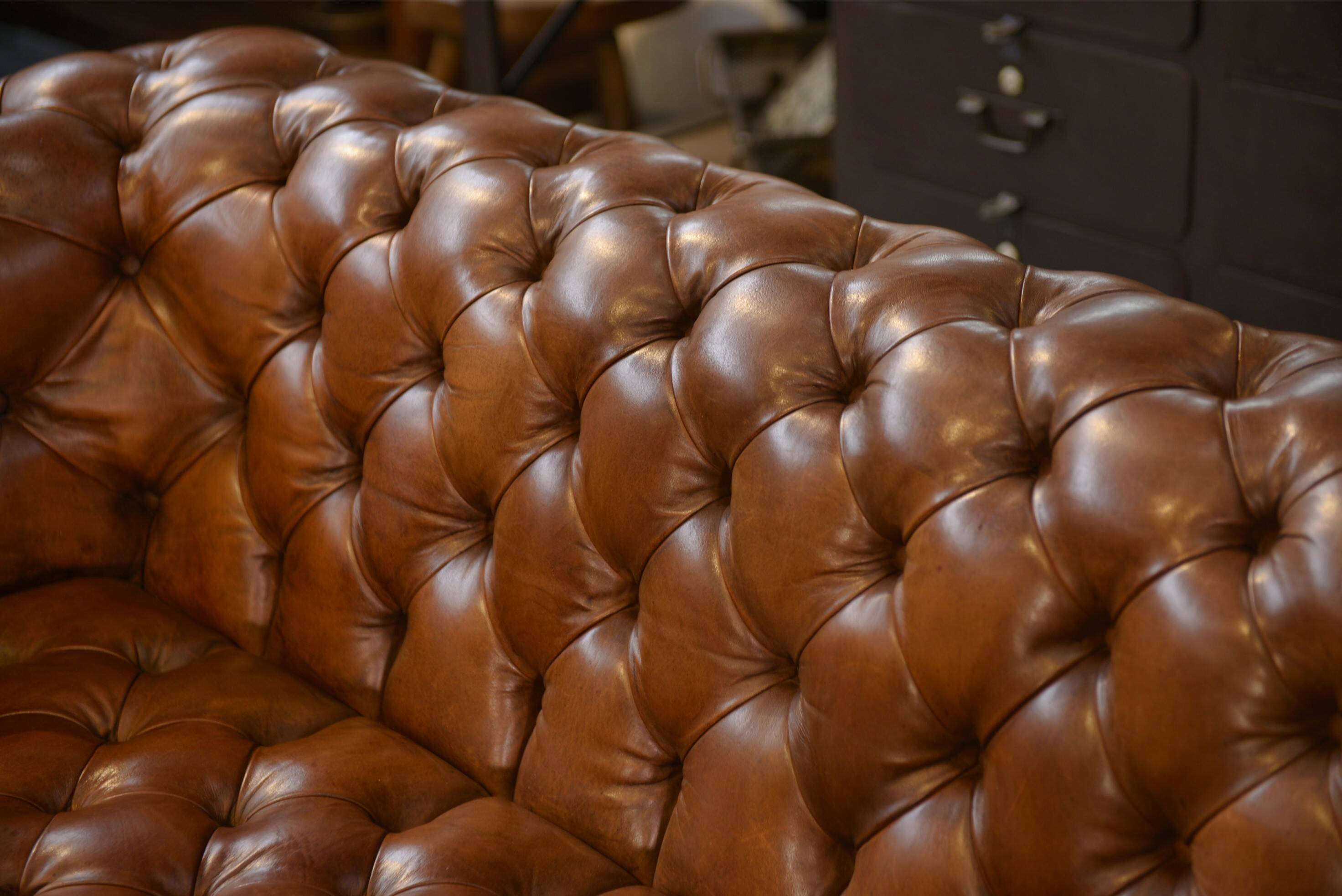 Tan leather tufted Chesterfield sofa