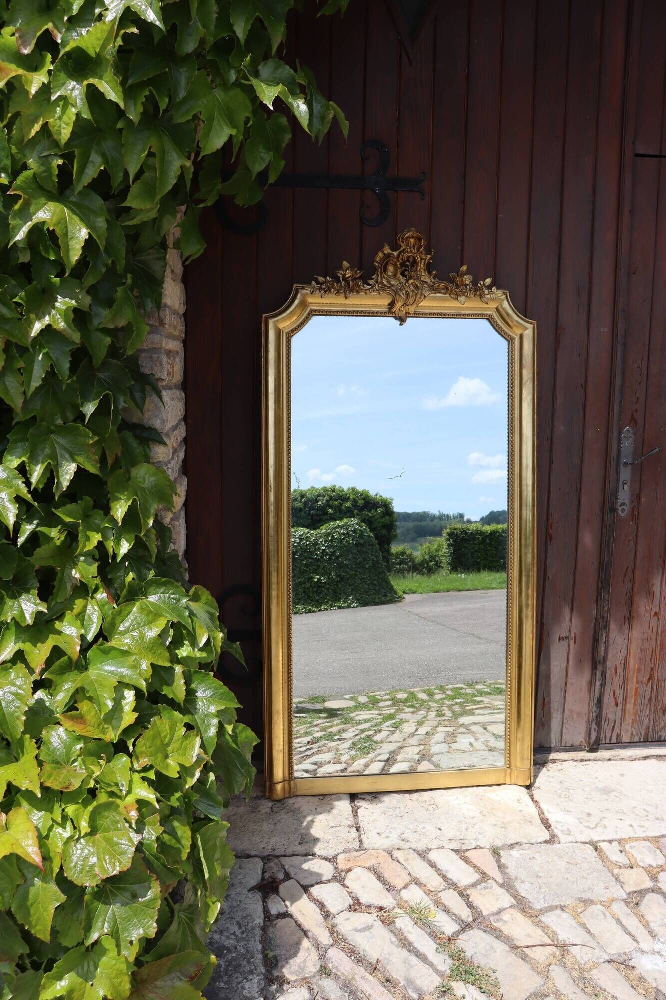 Large gold mirror in Louis XV style